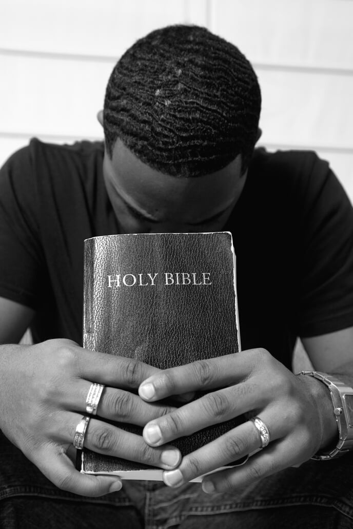 Man Praying with his Bible